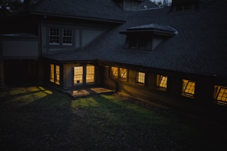 brown and gray house during night time