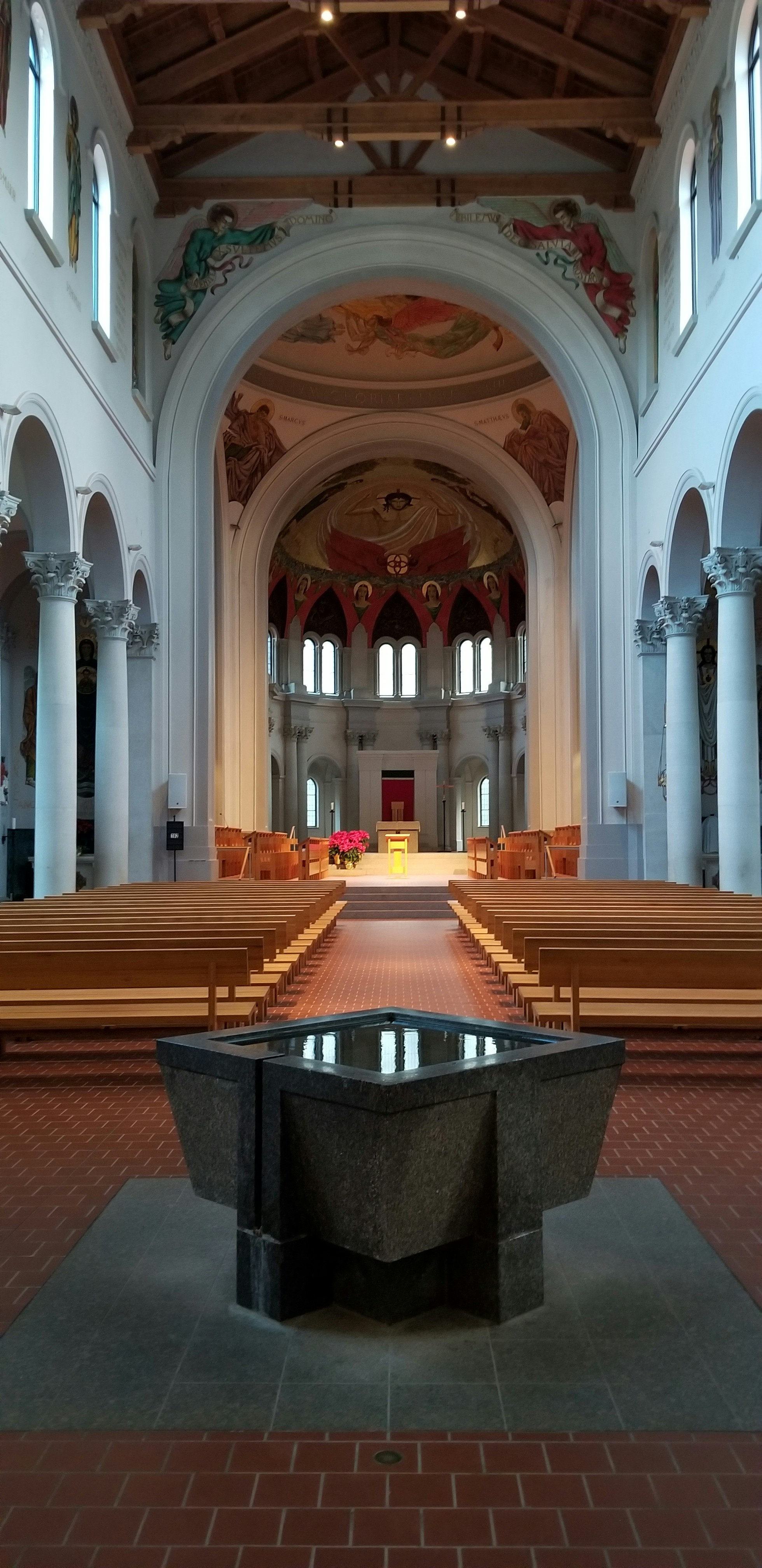 brown wooden chairs inside church