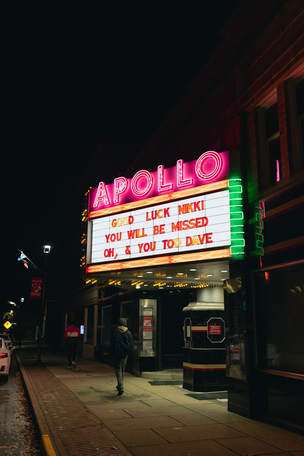 a marquee for a movie theater on a city street