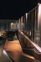 Evening scene of the fashion week venue with modern, clean architectural lines.