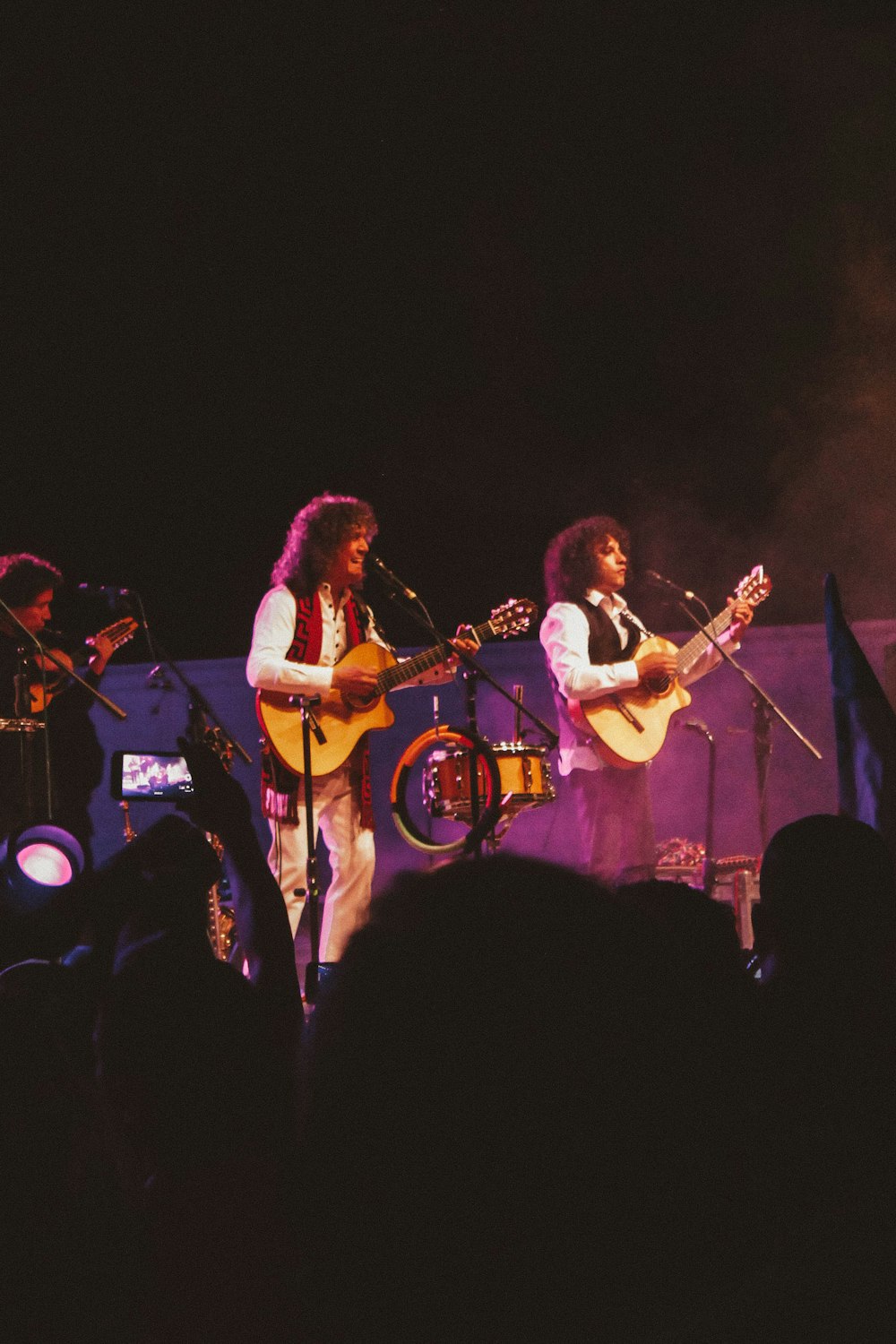 man playing guitar on stage