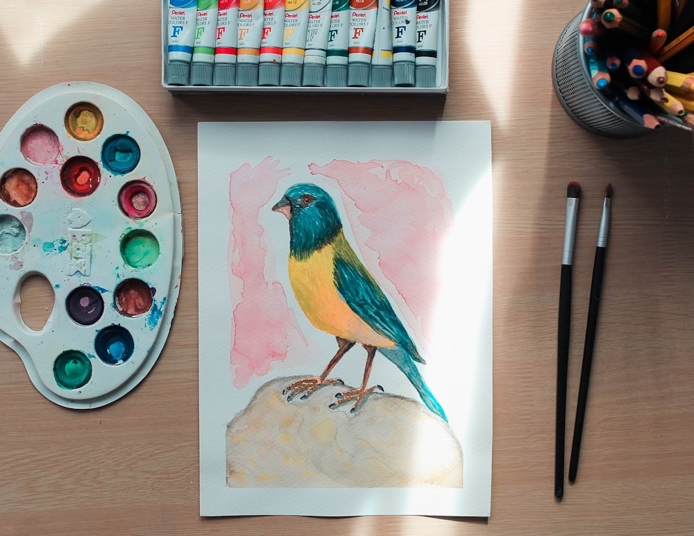 yellow blue and red bird painting