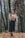 woman in black pants standing in forest