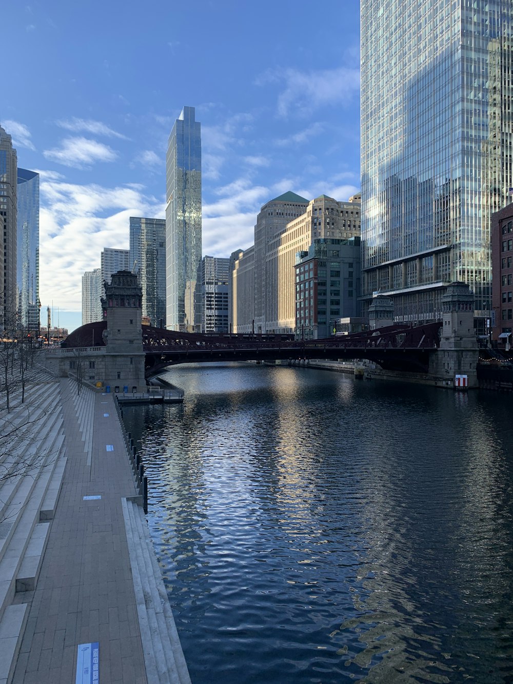 city skyline across body of water during daytime