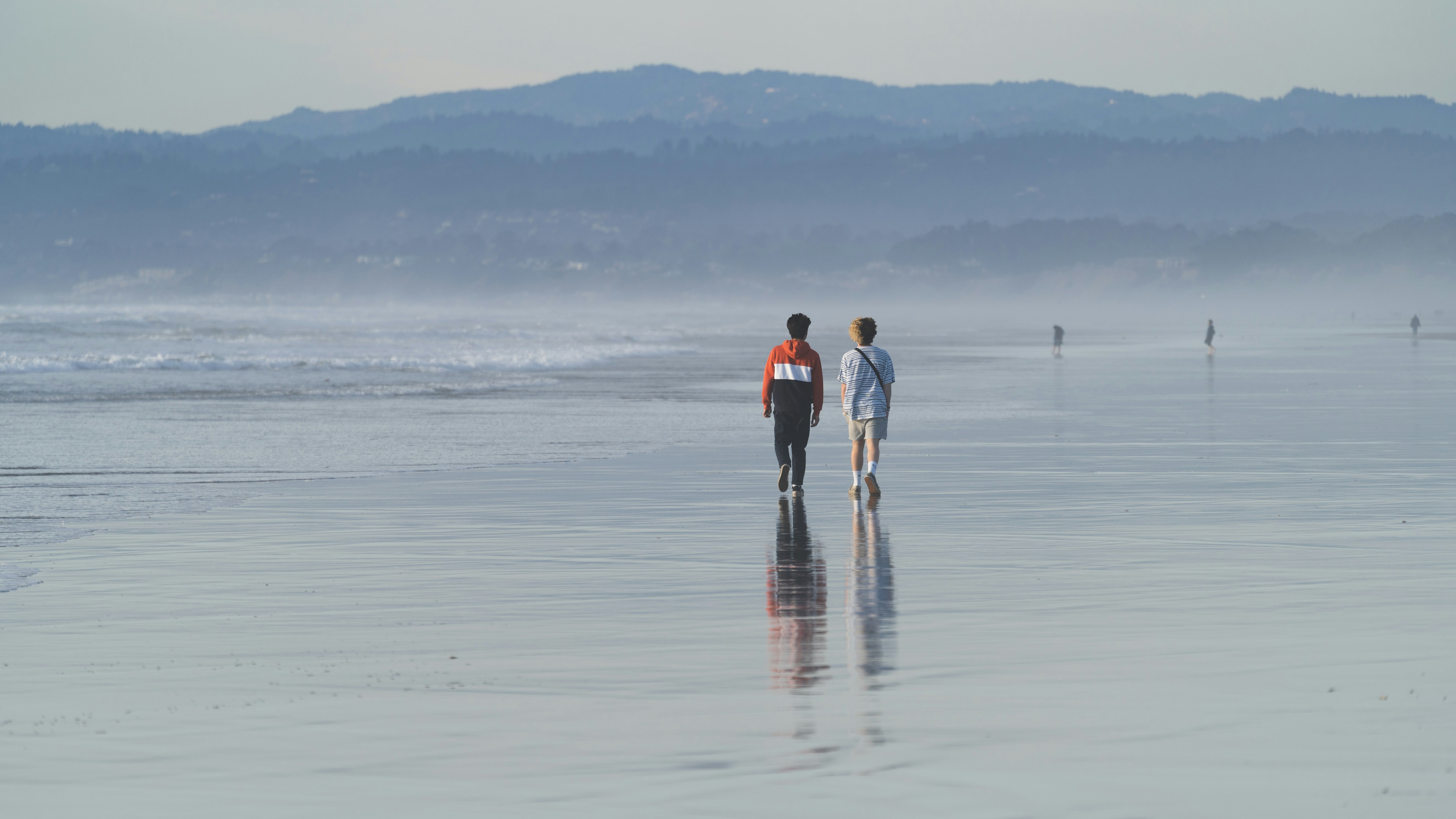 two people walking on a beach, symbolizing the journey forward - rehab centers in stuart