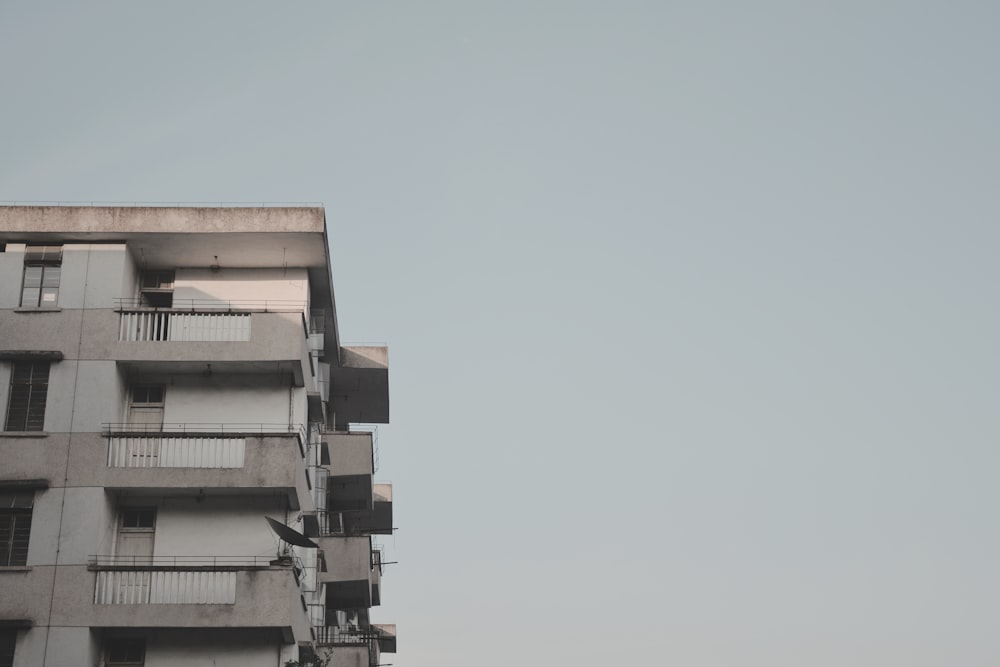 white concrete building under white sky during daytime