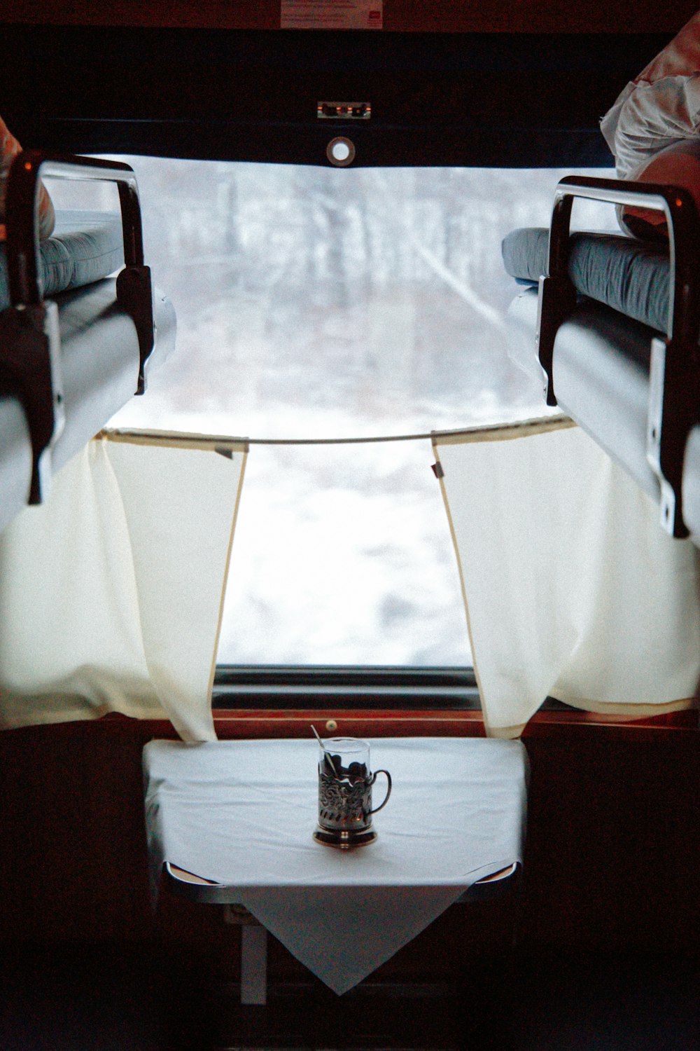 black and silver trophy on white textile