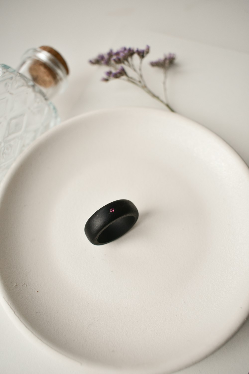 black cherry on white ceramic plate