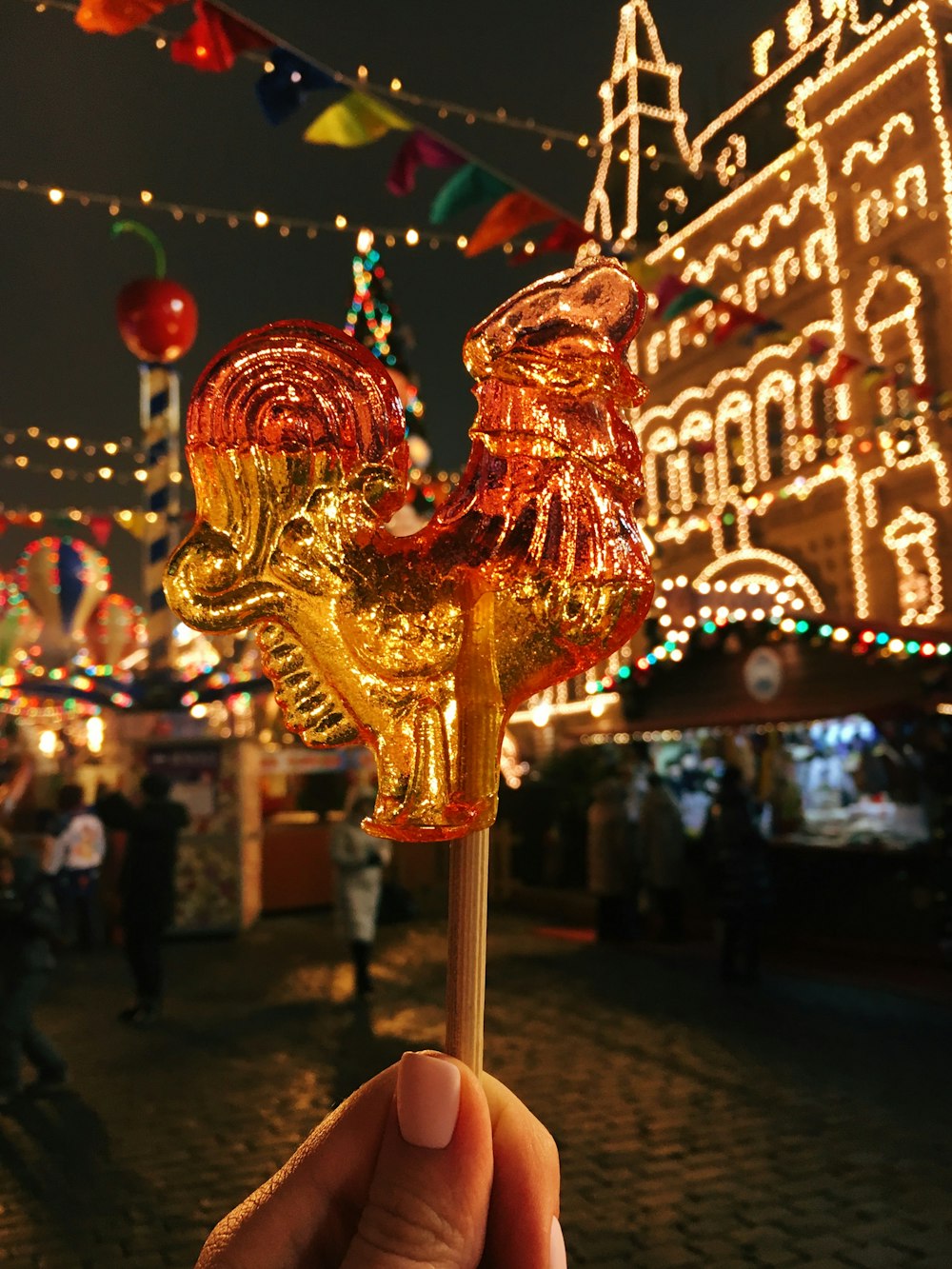 red and gold carousel in tilt shift lens