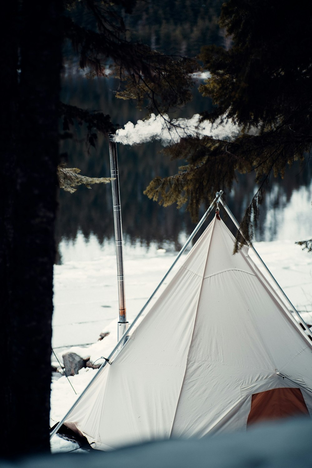 white tent on snow covered ground during daytime