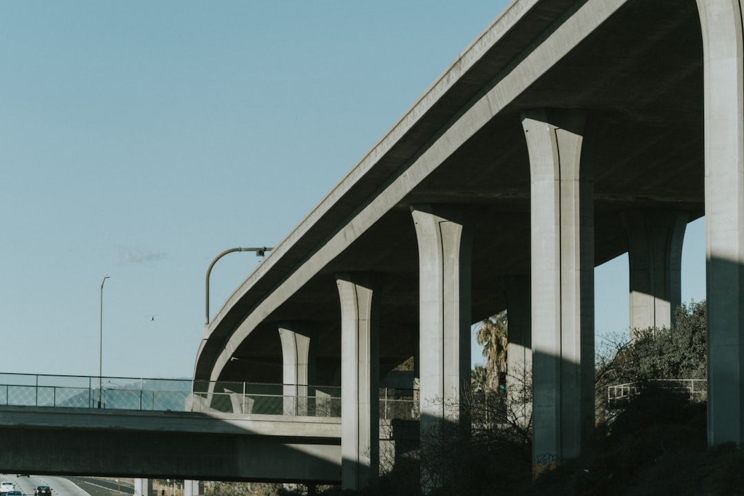 white concrete bridge over river during daytime