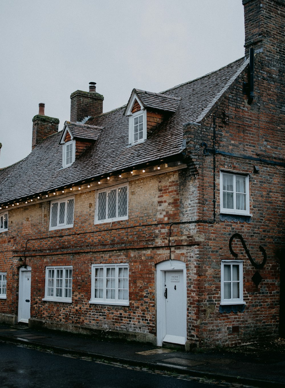 brown brick building under white sky during daytime