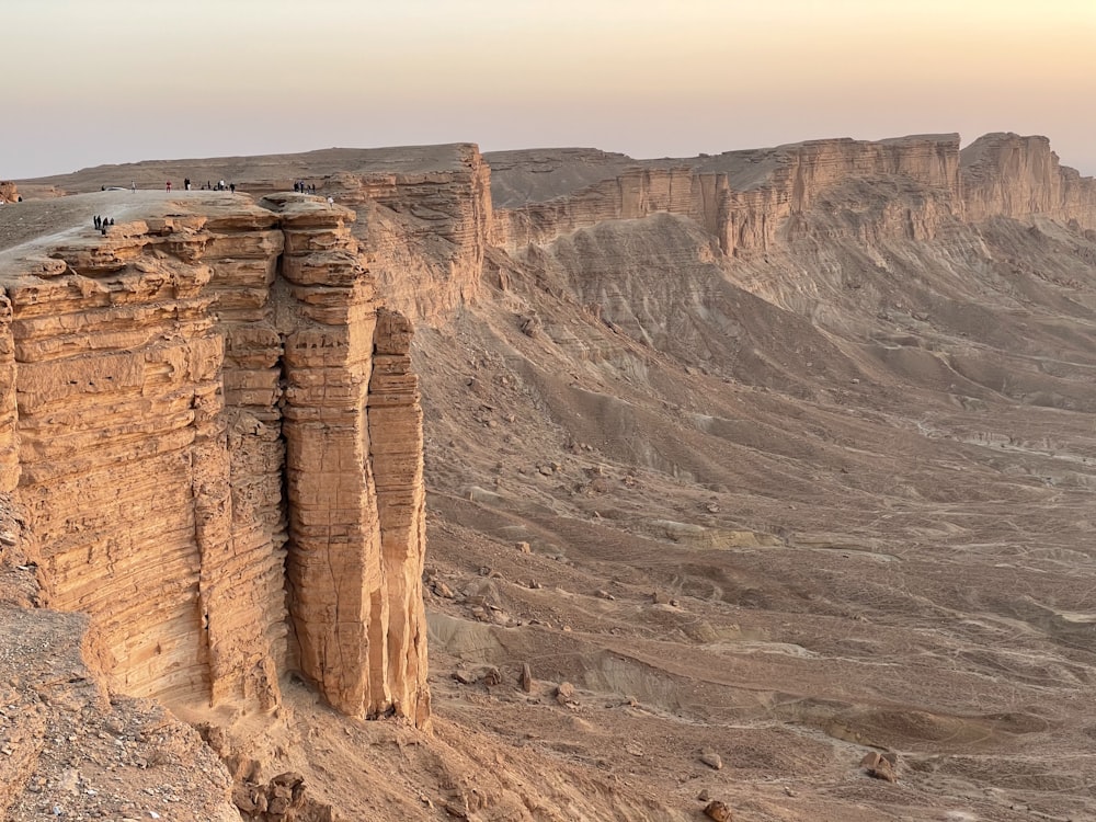 brown rock formation under white sky during daytime