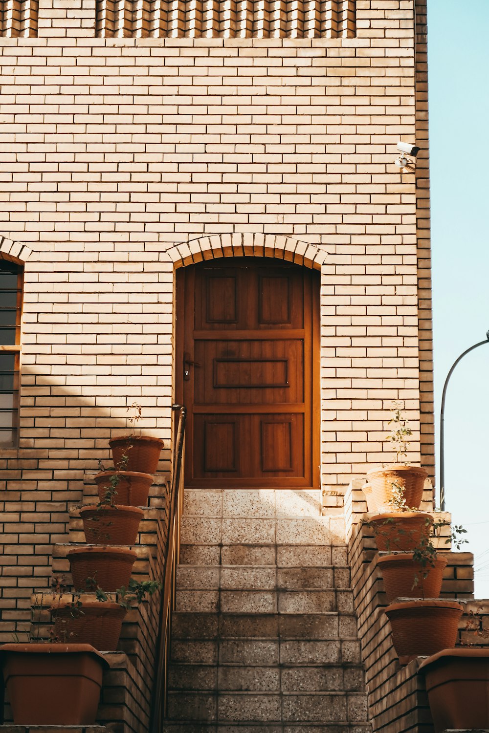 brown wooden door on brown brick building