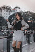 Casual streetwear outfit with black and white tones on a young woman walking in the city