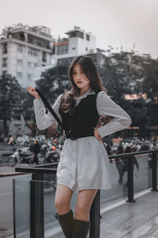 Casual streetwear outfit with black and white tones on a young woman walking in the city