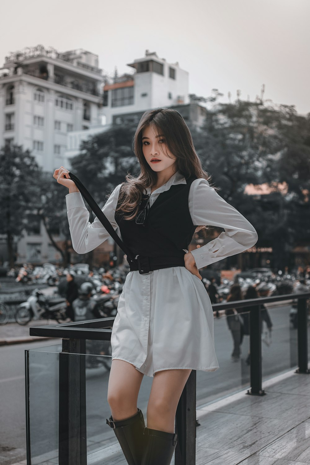 Woman in black long sleeve shirt and white skirt standing on the street  during daytime photo – Free Grey Image on Unsplash