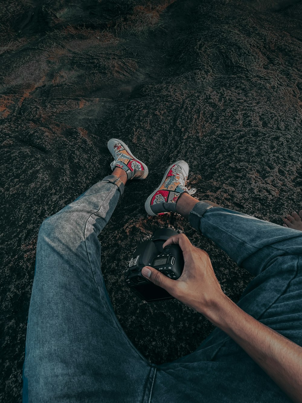 person in blue denim jeans and white and orange sneakers