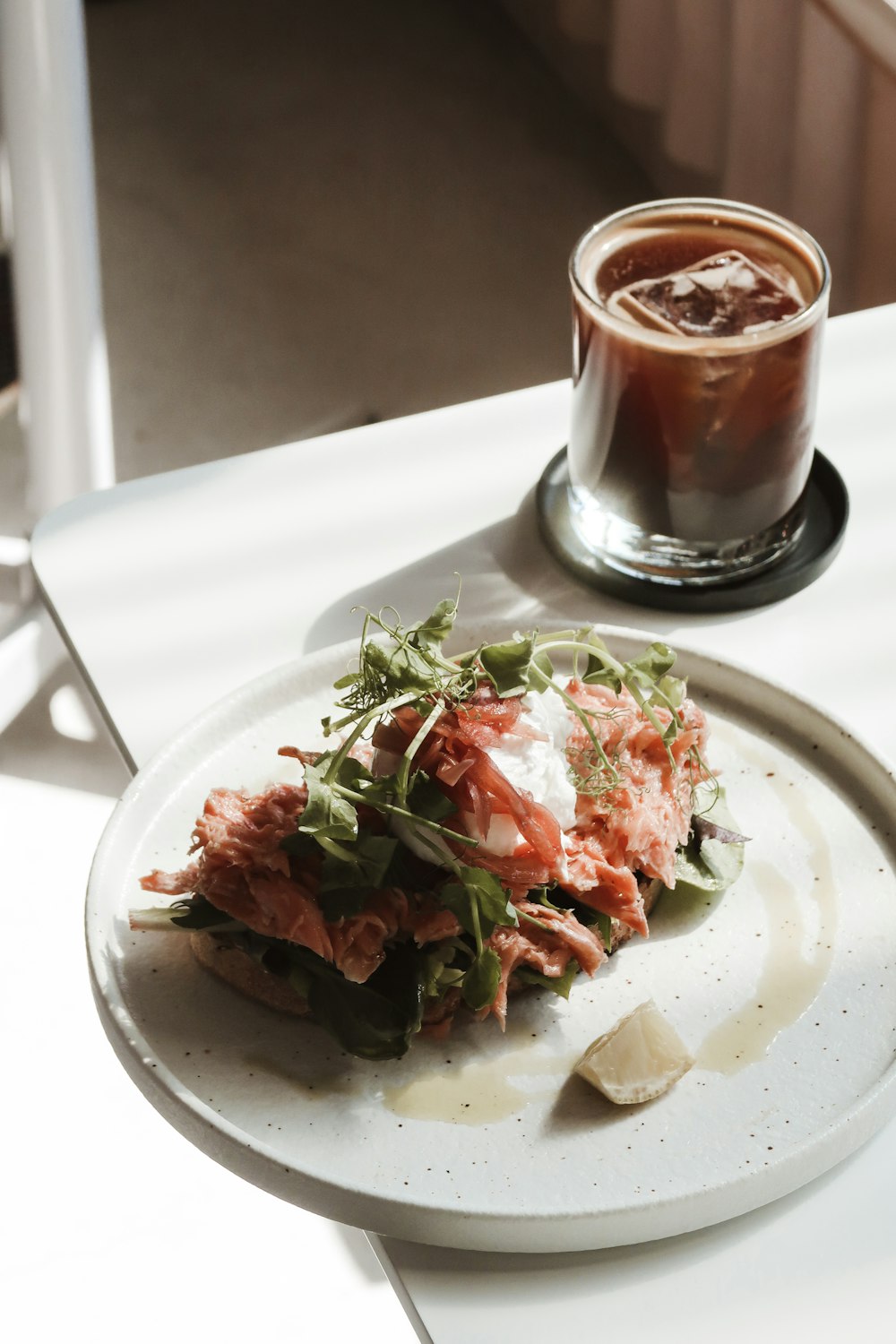 a plate of food and a drink on a table