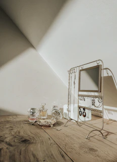 A cozy display of jewelry pieces hanging from a mason jar lid turned into a creative stand