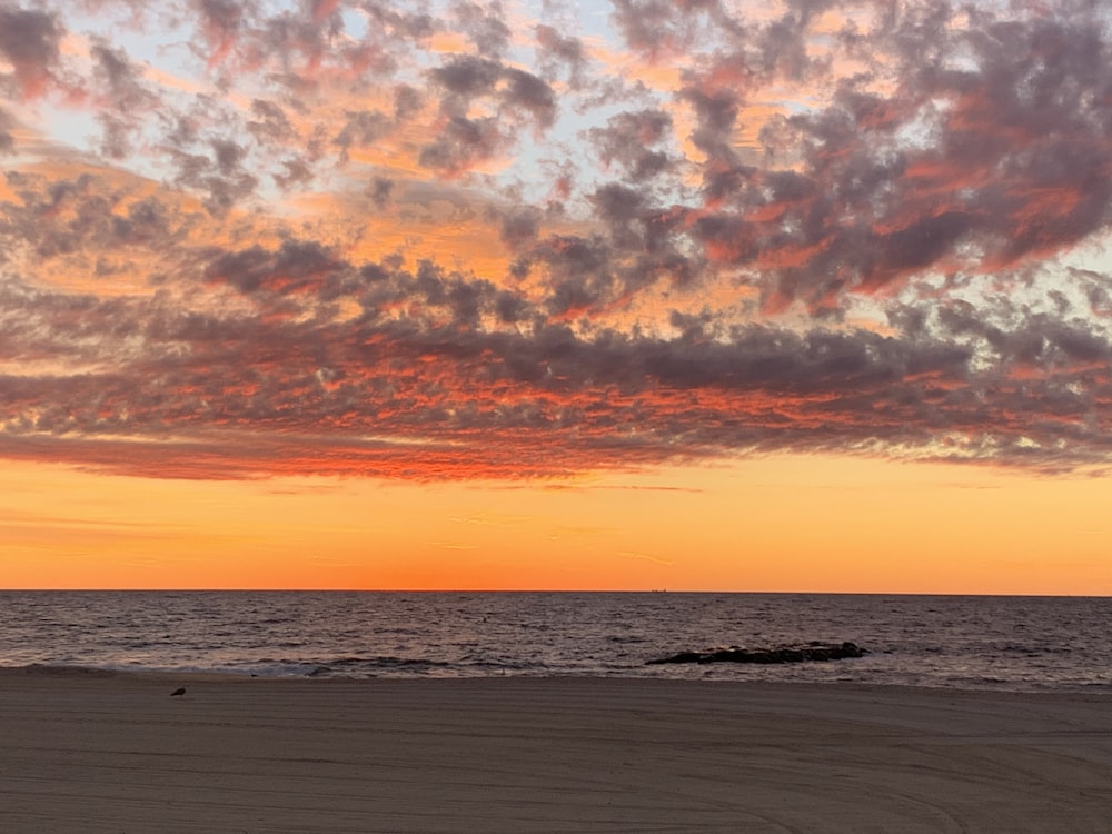 blue and orange cloudy sky over the beach