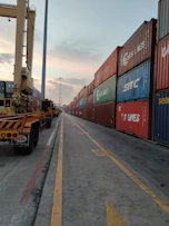 red and blue cargo containers on a sunny day