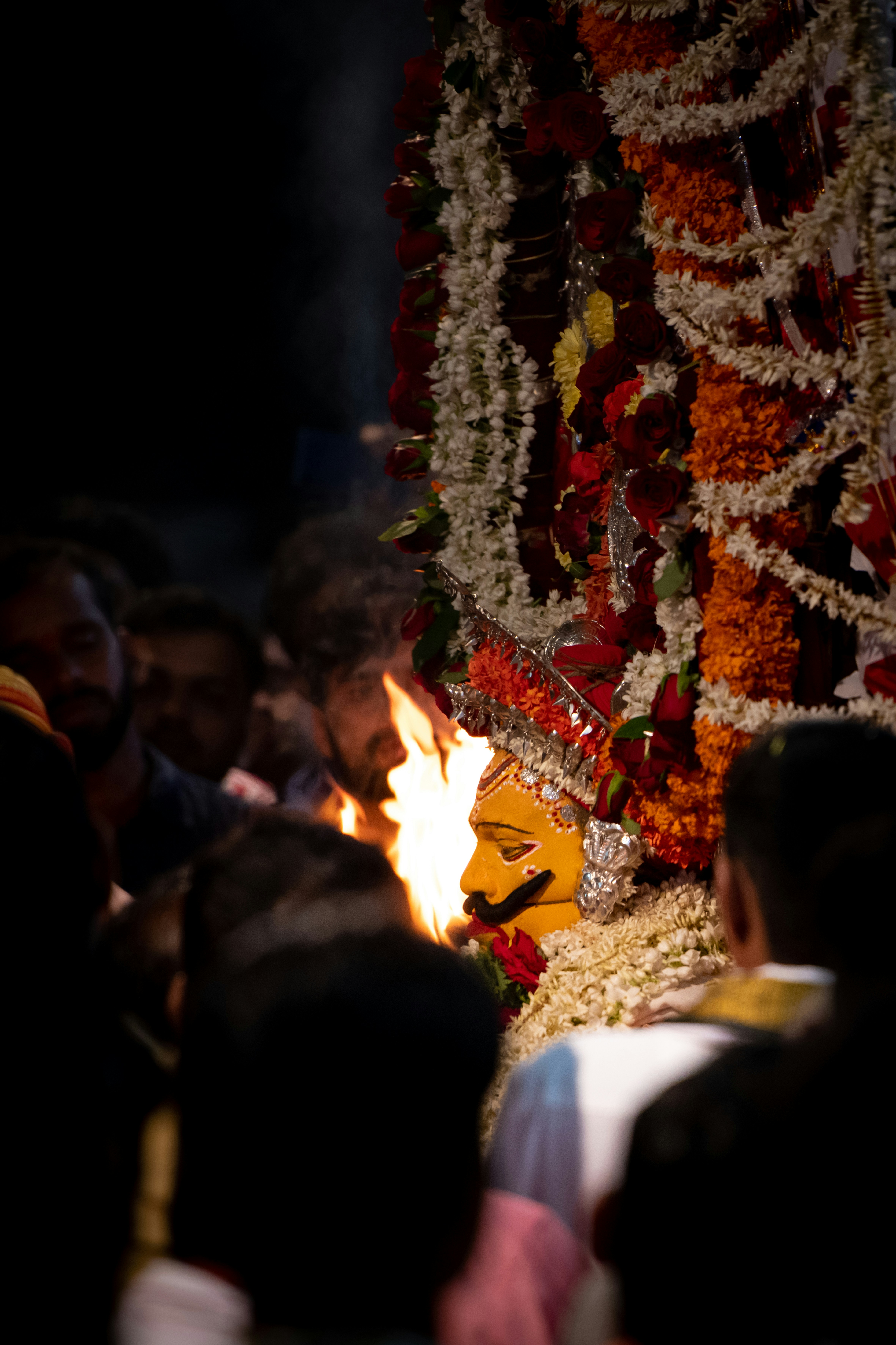 people sitting on chair near bonfire