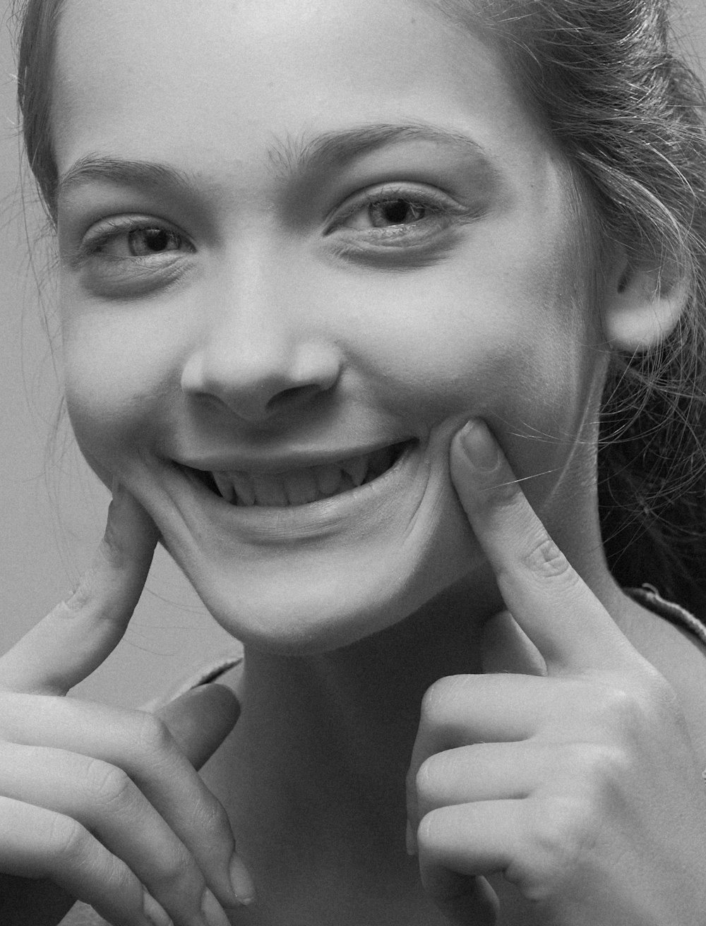 grayscale photo of smiling woman