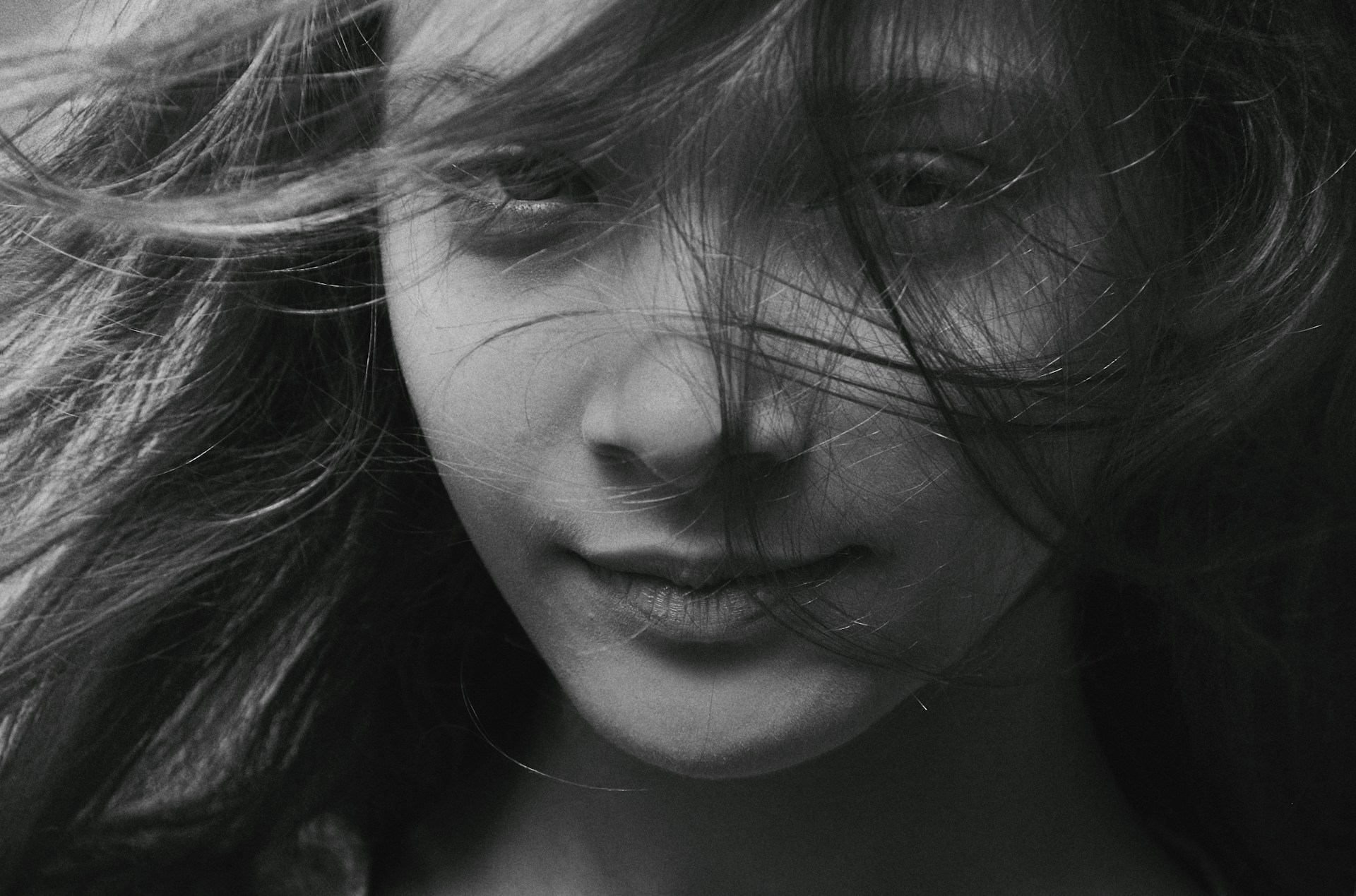 grayscale photo of womans face