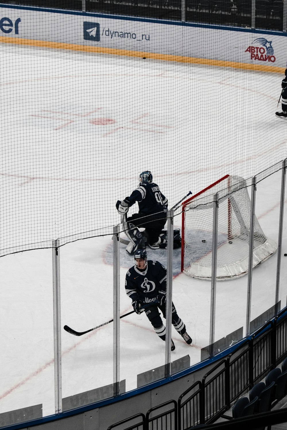 2 men playing ice hockey