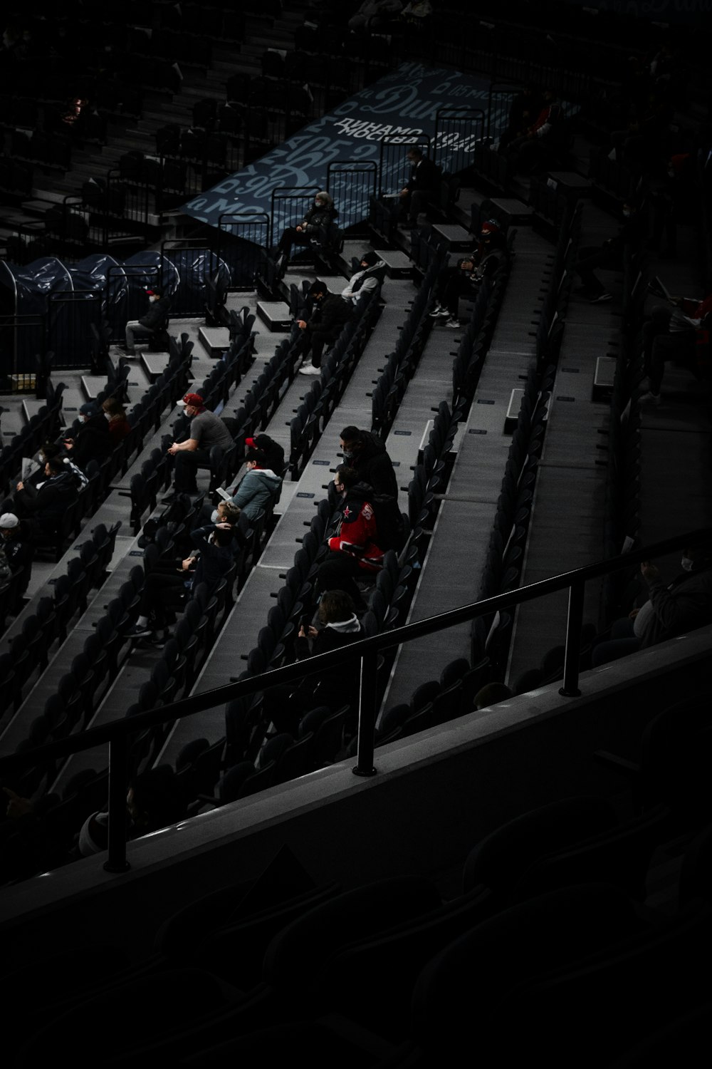 people in black and blue shirts sitting on black chair