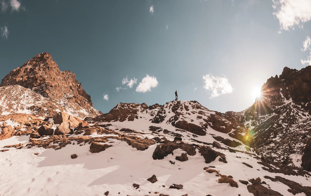 Climber on the snow-covered slopes of Mount Toubkal, High Atlas, Morocco
