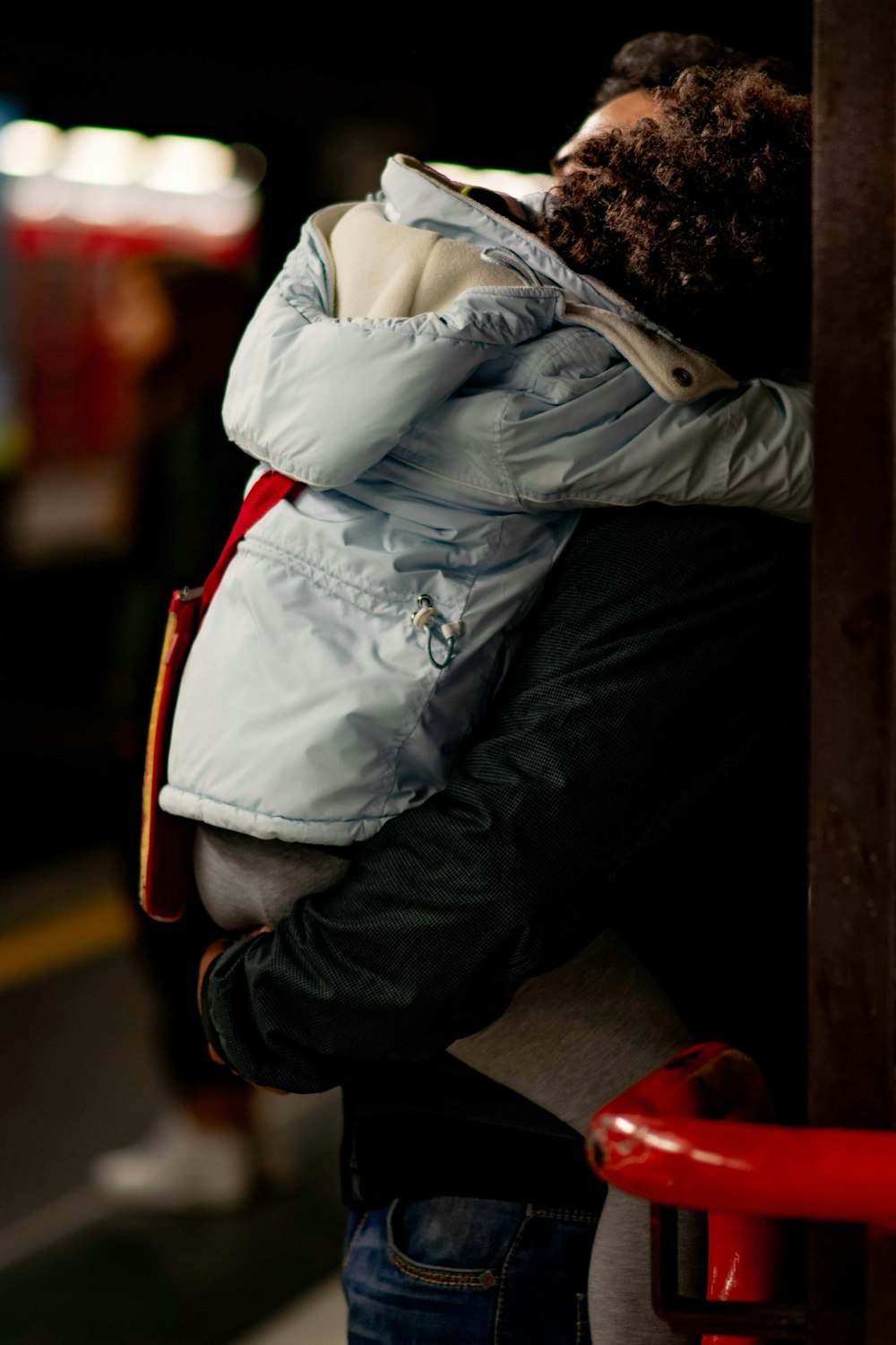 person in white jacket and black pants