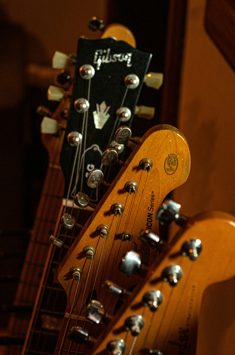 brown guitar headstock in close up photography