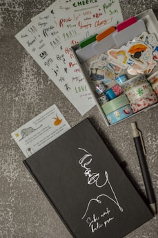 black pen beside white paper