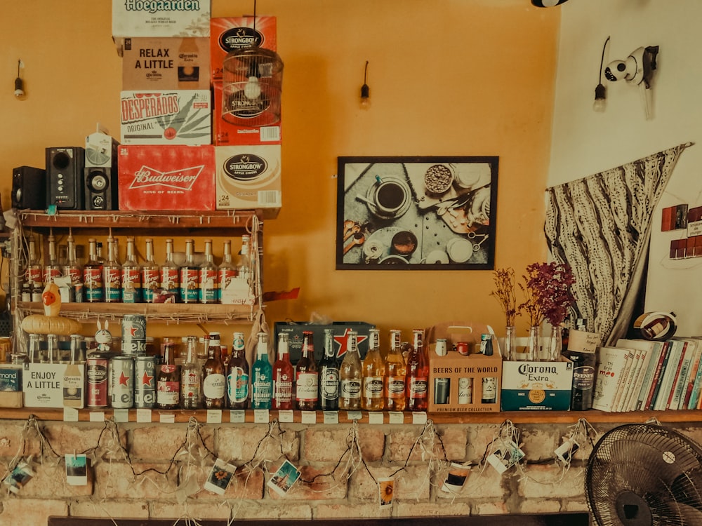 brown wooden wall mounted shelf with bottles