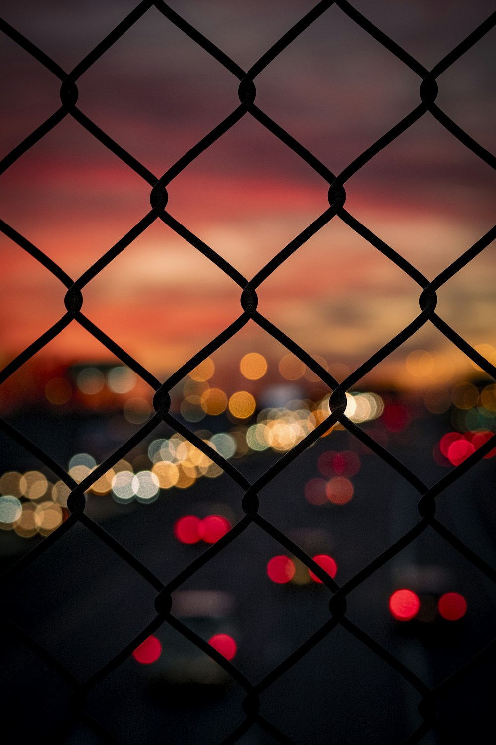 bokeh photography of chain link fence