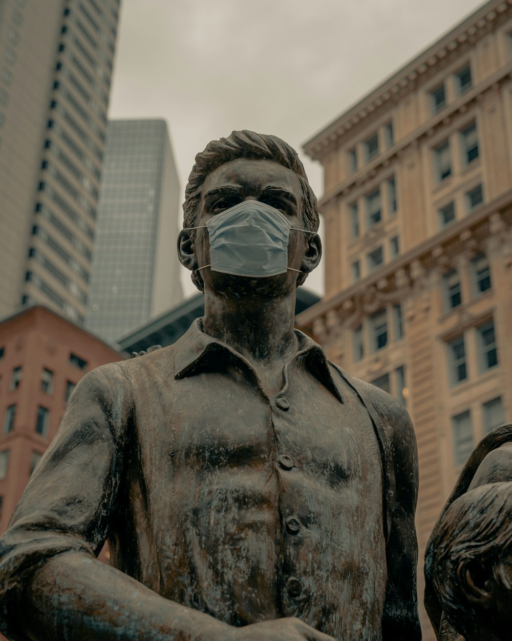 man in black leather jacket wearing black mask