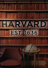 a chair and table in front of a bookshelf