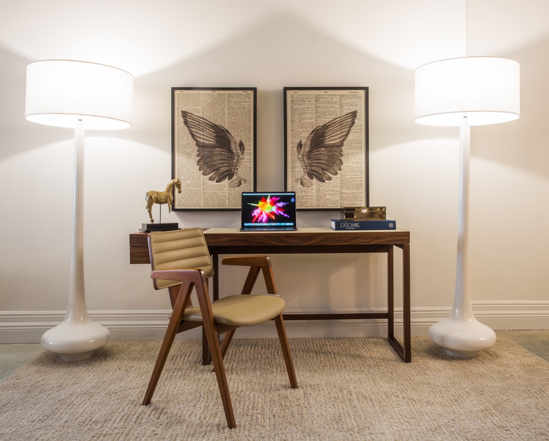 brown wooden table with white table lamp
