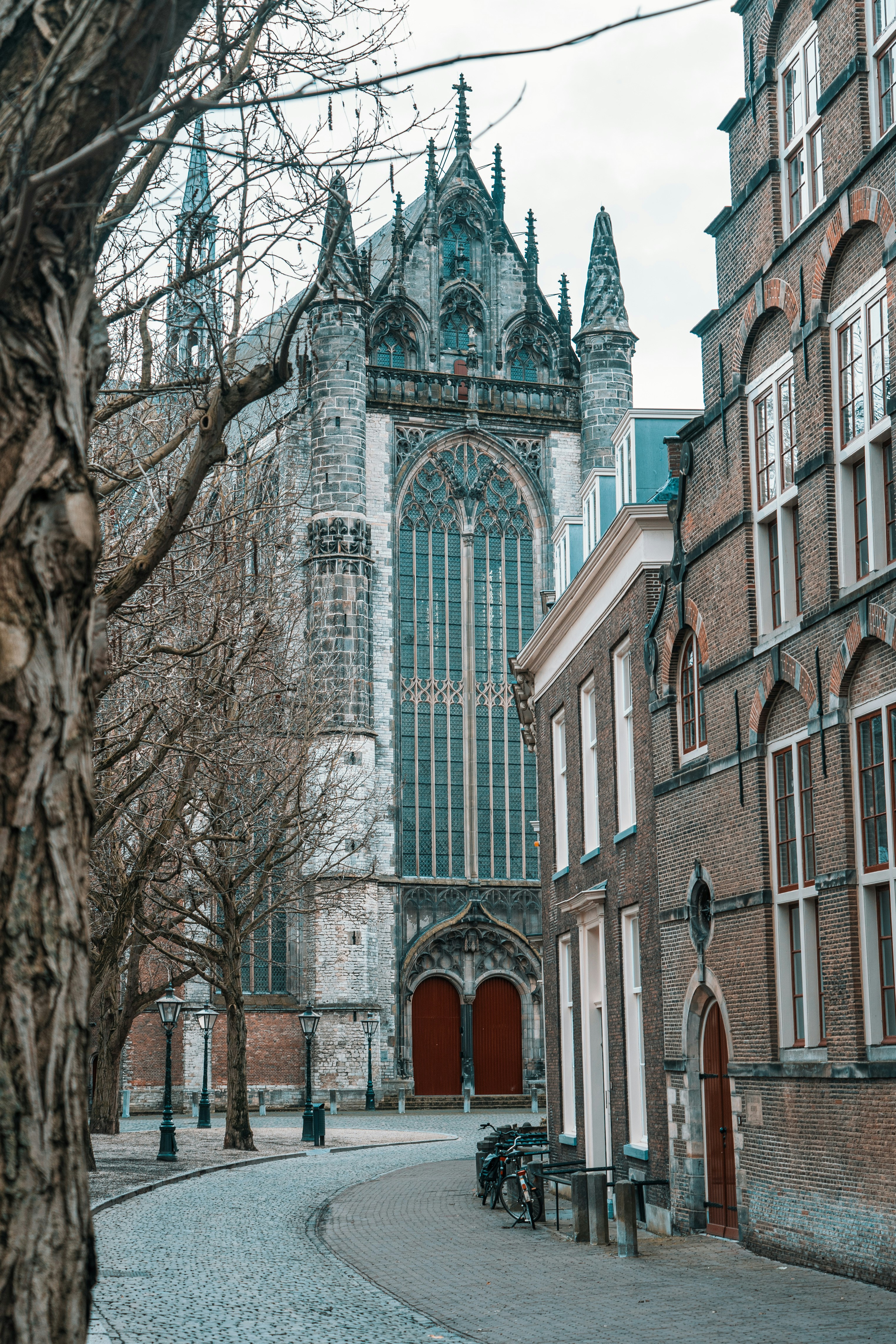 Street in the medieval city centre of Leiden looking out on the Hooglandse Kerk, the Netherlands