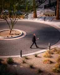 Exterior walkway of Desert Haven, showing a peaceful desert morning scene.