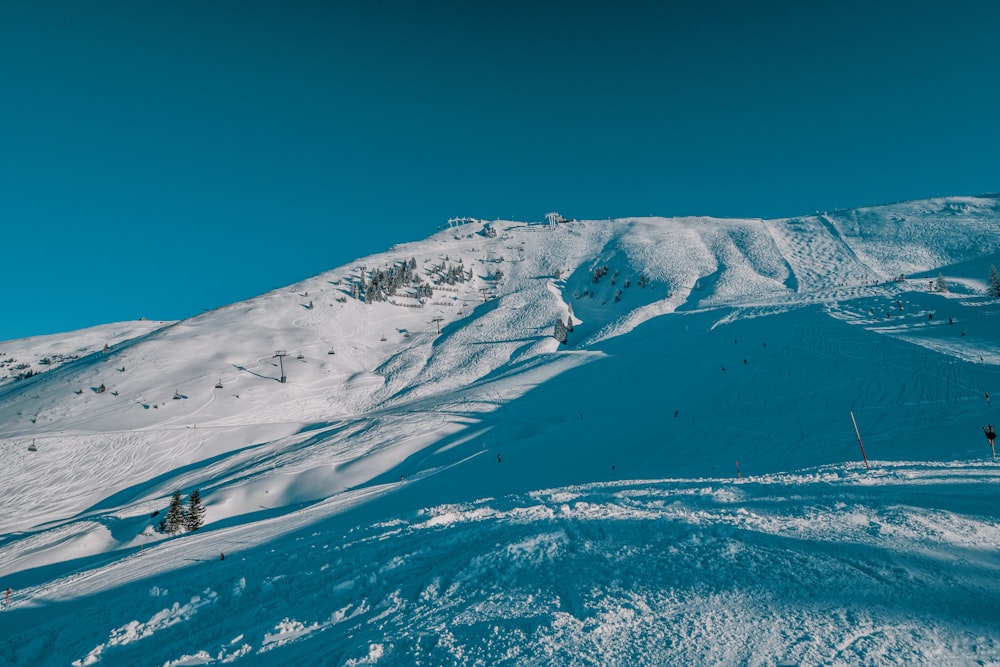 snow covered mountain under blue sky during daytime