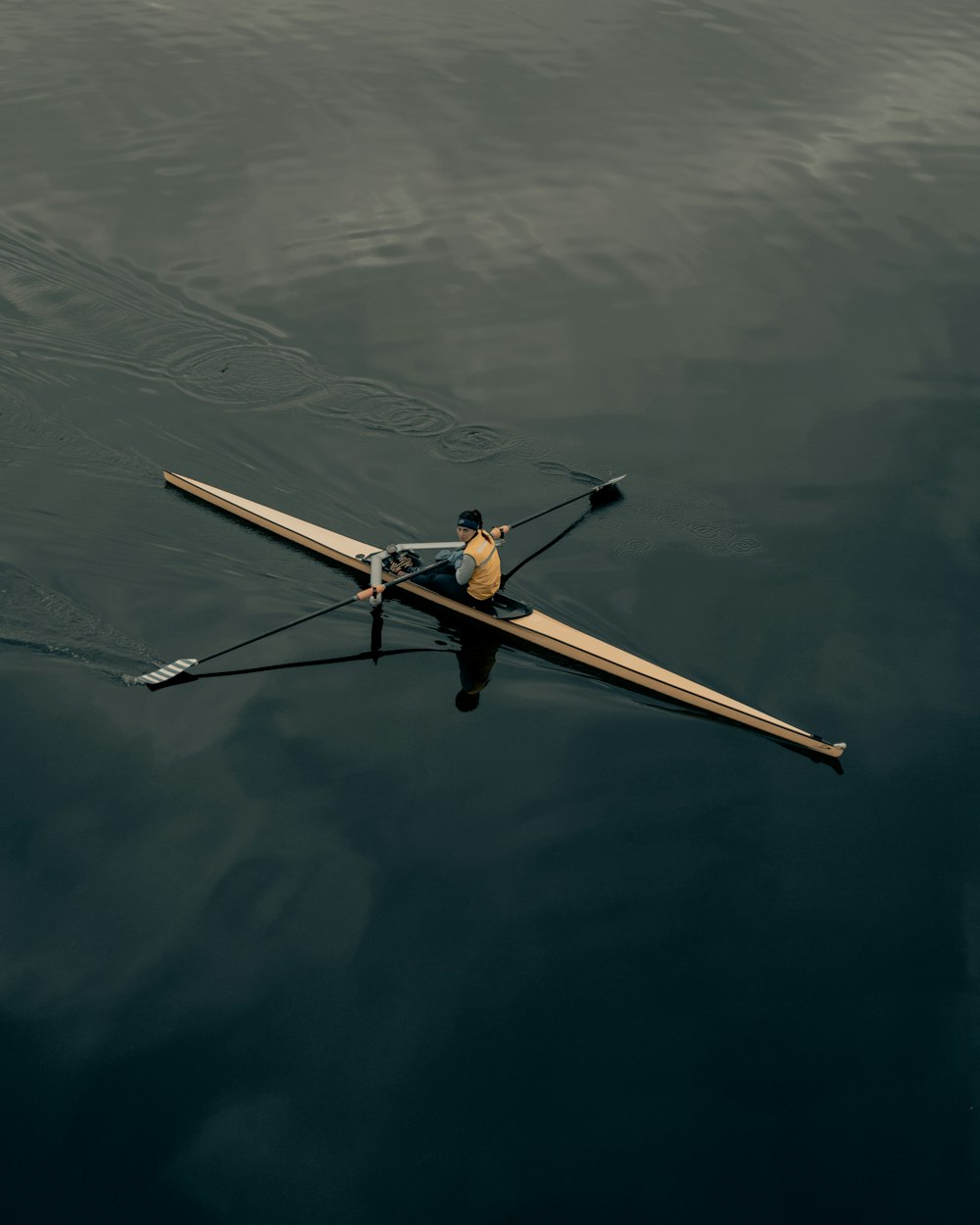 brown wooden boat on body of water during daytime