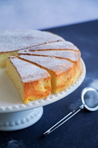 Slice of pastiera napoletana tart dusted with sugar