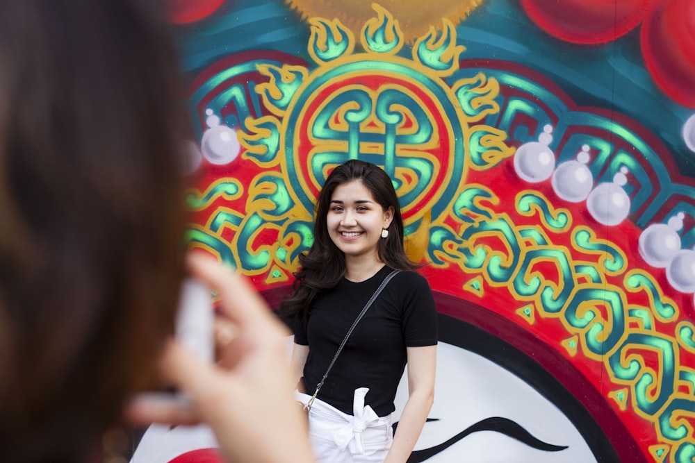 woman in black shirt and white skirt