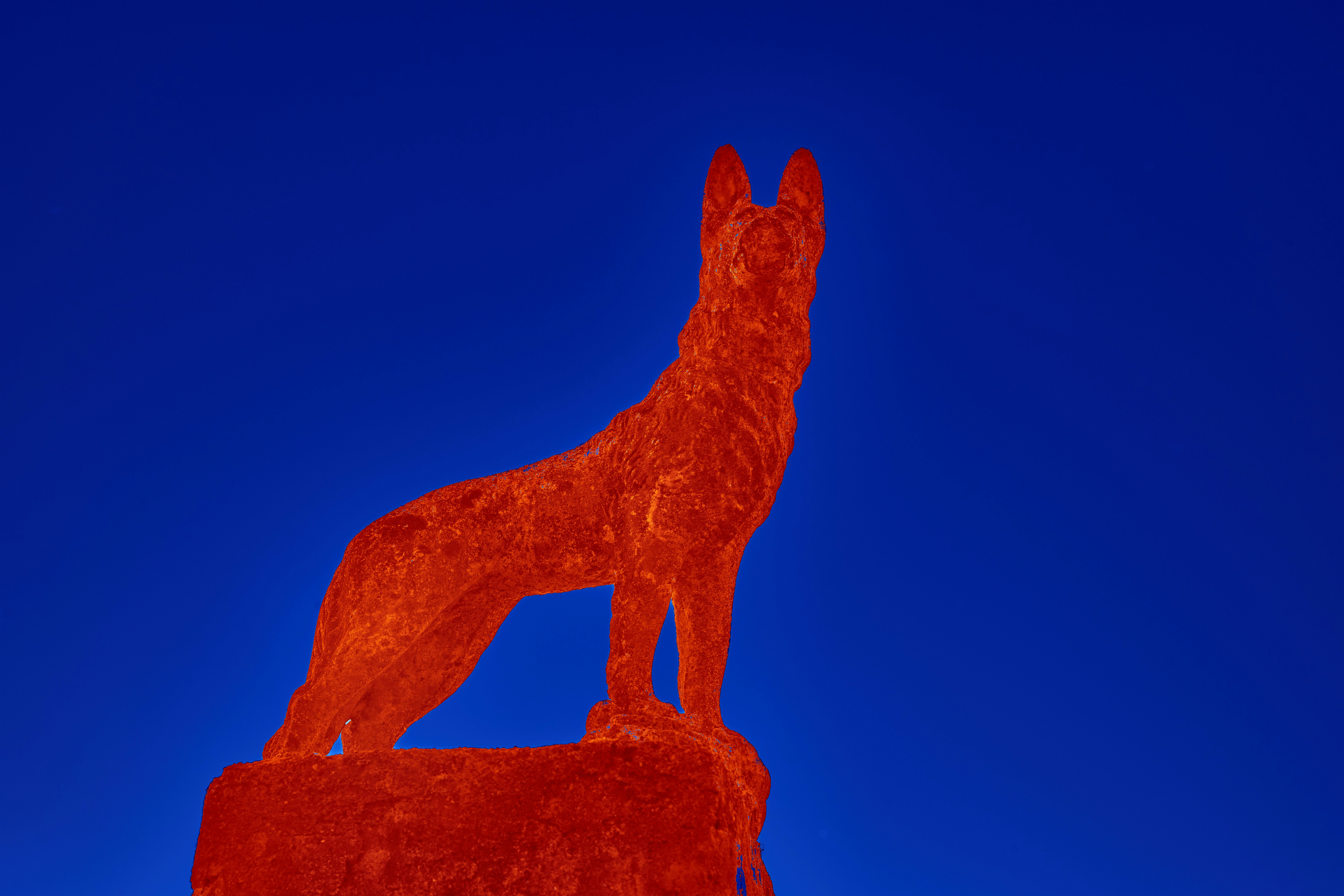 Brown and black dog statue