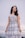 woman in white and black plaid sleeveless dress