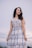 woman in white and black plaid sleeveless dress