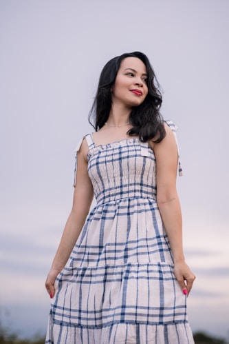 woman in white and black plaid sleeveless dress